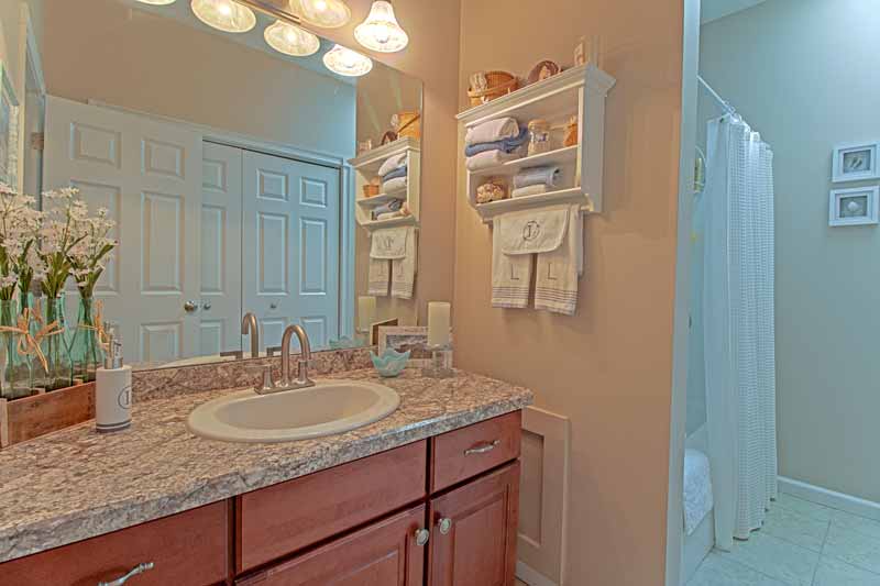 View of main bathroom vanity & mirror